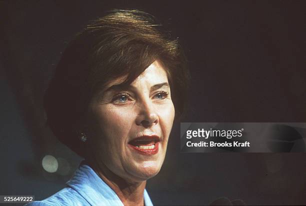 Portrait of Laura Bush as she speaks at a lunch in her honor.