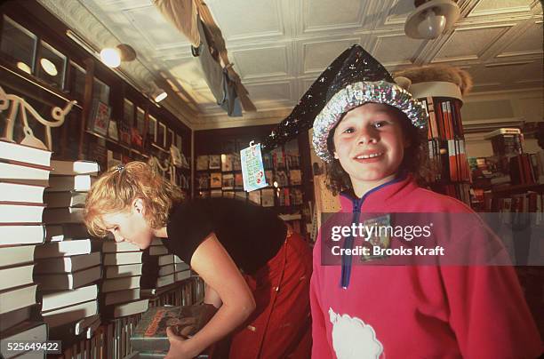 People celebrate the release of the new Harry Potter book by JK Rowling with costumes and parties.