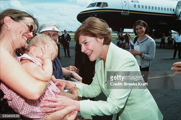 Laura Bush greets the crowd at a rally for her husband, Republican Presidential candidate George W. Bush.