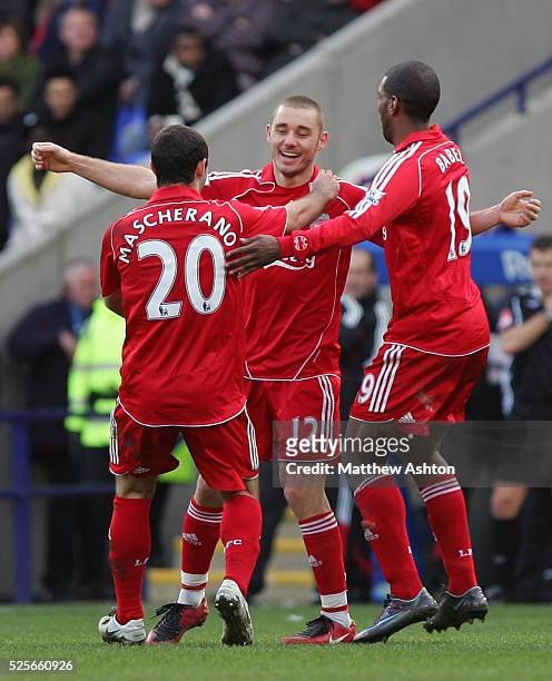 Fabio Aurelio of Liverpool is congratulated by Javier Mascherano and Ryan Babel of Liverpool after he scores the third goal | Location: Bolton,...