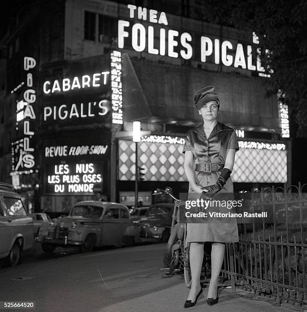 Helene Martini, aka the "Empress of the Night", is the owner of several rooms in Pigalle including the cabaret "Folies Pigalle" and "Pigalle's".