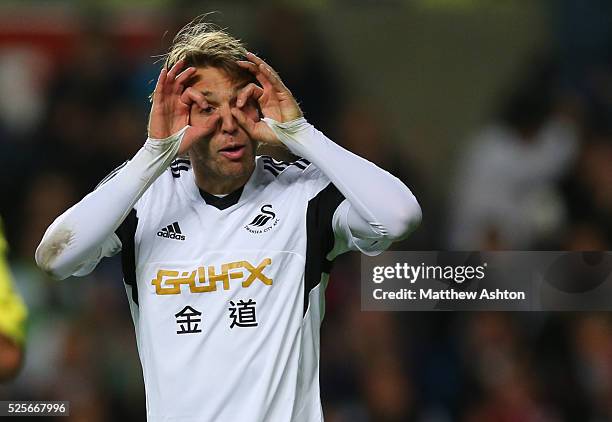 Miguel Michu of Swansea City celebrates after scoring a goal to make it 2-2