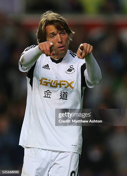 Miguel Michu of Swansea City celebrates after scoring a goal to make it 2-2