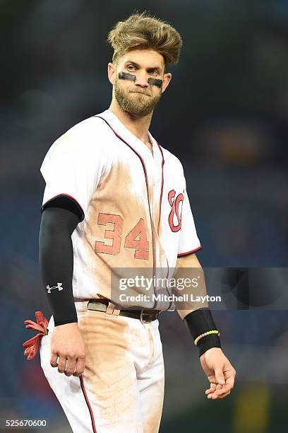 Bryce Harper of the Washington Nationals reacts after grounding out with bases loaded in the eighth inning during a baseball game against the...