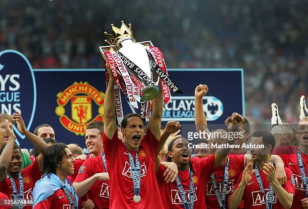 Rio Ferdinand of Manchester United lifts the FA Barclays Premier League trophy after being champions and winning the league season 2007-2008