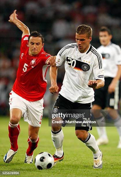 Dariusz Dudka of Poland and Lukas Podolski of Germany during the EURO 2008 preliminary round group B soccer match between Germany and Poland at the...