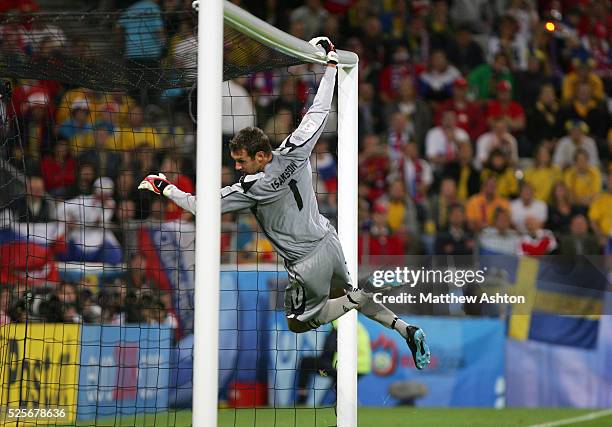 Andreas Isaksson of Sweden hangs from the crossbar during the EURO 2008 preliminary round group D soccer match between Russia and Sweden at the...