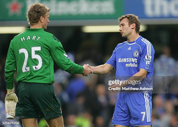 Joe Hart of Manchester City who let in 6 goals is consoled by Andriy Shevchenko of Chelsea at the end of the game