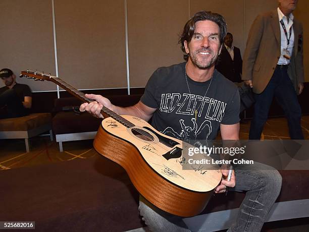Songwriter Brett James poses with a #StandWithSongwriters guitar, which will be presented in May to members of Congress to urge them to support...