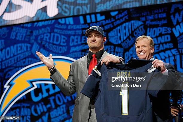 Joey Bosa of Ohio State holds up a jersey with NFL Commissioner Roger Goodell after being picked overall by the San Diego Chargers during the first...