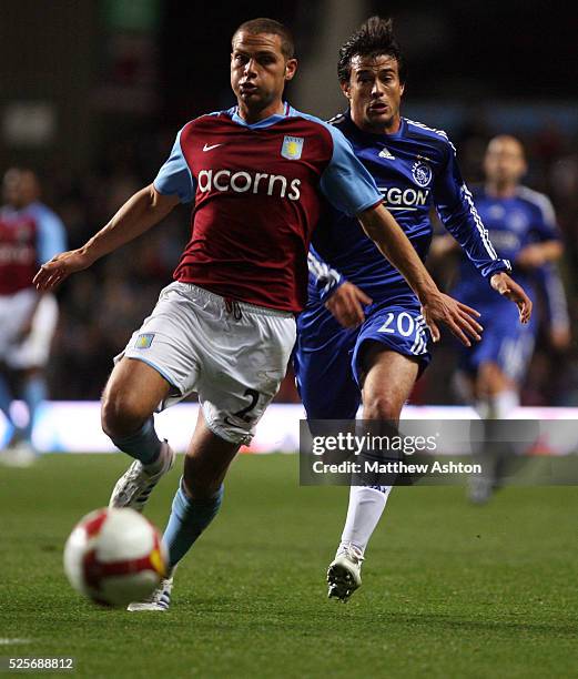 Luke Young of Aston Villa and Dario Cvitanich of Ajax