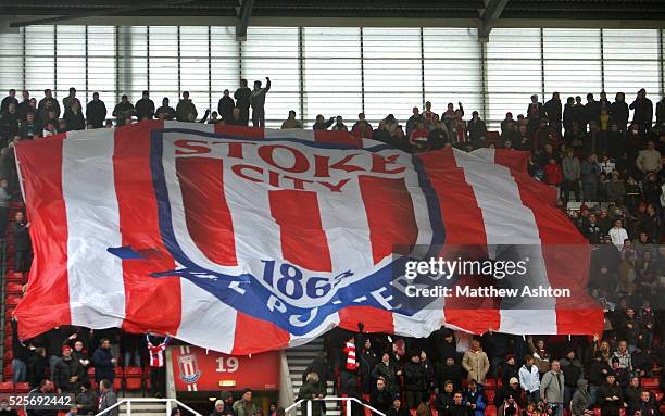 Stoke City fans hold up a giant flag