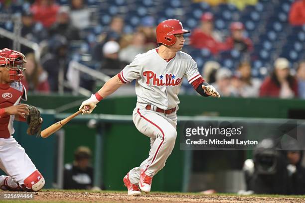 David Lough of the Philadelphia Phillies singles in Maikel Franco for the third run in the ninth inning during a baseball game against the Washington...