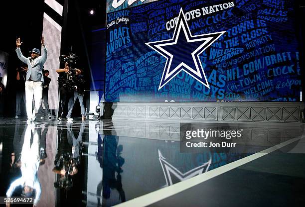 Ezekiel Elliott of Ohio State walks on stage after being picked overall by the Dallas Cowboys during the first round of the 2016 NFL Draft at the...