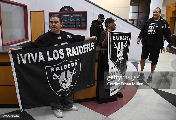 Oakland Raiders fans Tony Curiel, Eric Carrillo, Richard Cervera, and John Baietti, all of Nevada, wait for Raiders owner Mark Davis to arrive at a...