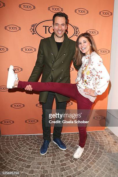 Alexander Mazza and -Karen Webb wearing Tod's shoes during the TOD'S 'The art of leather' party on April 28, 2016 in Munich, Germany.