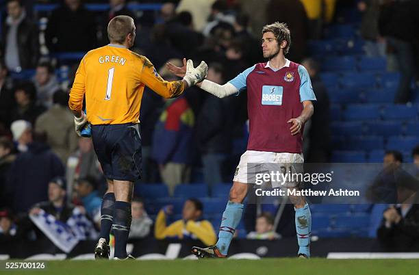 Valon Behrami of West Ham United celebrates the point with Robert Green