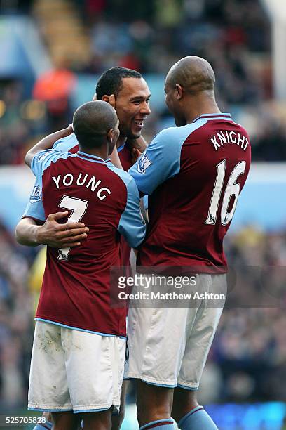 John Carew of Aston Villa is congratulated by Ashley Young and Zat Knight of Aston Villa after scoring to make it 2-0