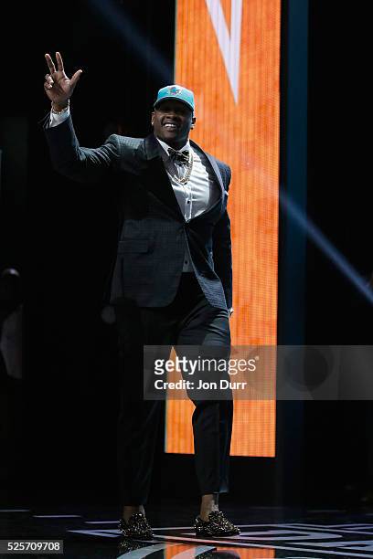 Laremy Tunsil of Ole Miss walks on stage after being picked overall by the Miami Dolphins during the first round of the 2016 NFL Draft at the...