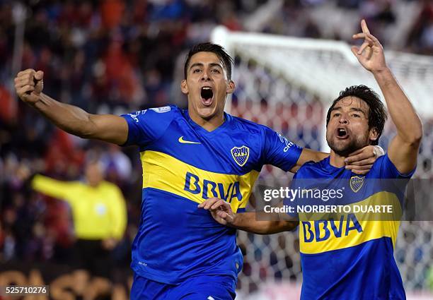 Argentina's Boca Juniors player Nicolas Lodeiro celebrates with Cristian Pavon after scoring against Paraguay's Cerro Porteno during their...