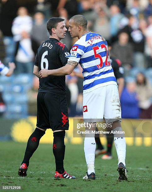 Chris Baird of Fulham and Bobby Zamora of Queens Park Rangers at the end of the match