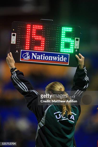 The fourth official, Emma Everson, holds up the electronic substitute board