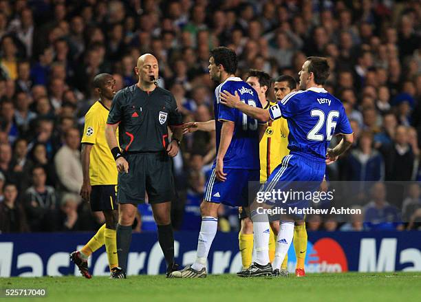 Referee Tom Henning Ovrebo from Norway waves away appeals from Michael Ballack of Chelsea as he claims for a penalty