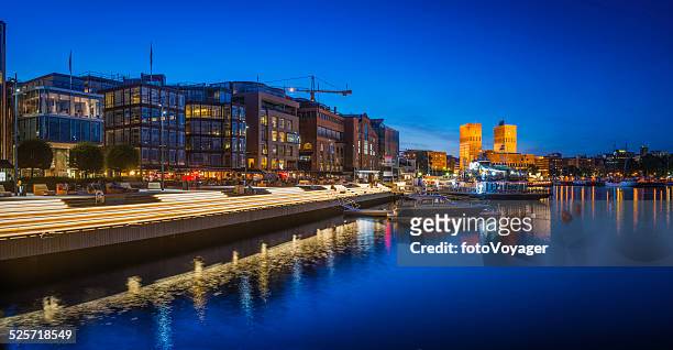 olso illuminated harbour waterfront aker brygge restaurants apartments panorama norway - summer evening stock pictures, royalty-free photos & images