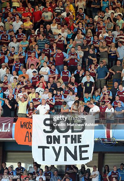 Aston Villa fans hold up a banner reading - Sob on the Tyne -as Newcastle United are relegated