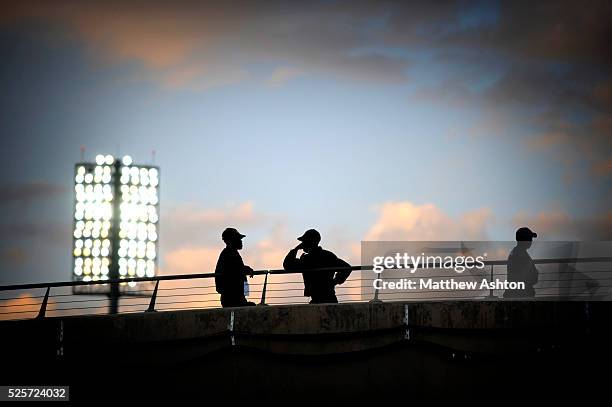 Security guards stand on the back row against a sunset and the Floodlights in the The Royal Bafokeng Stadium in Rustenburg, Phokeng, South Africa....