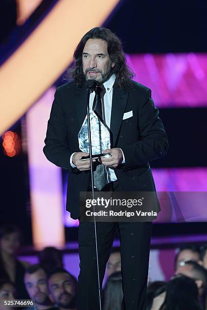 Marco Antonio Solis recieves award onstage at the Billboard Latin Music Awards at Bank United Center on April 28, 2016 in Miami, Florida.