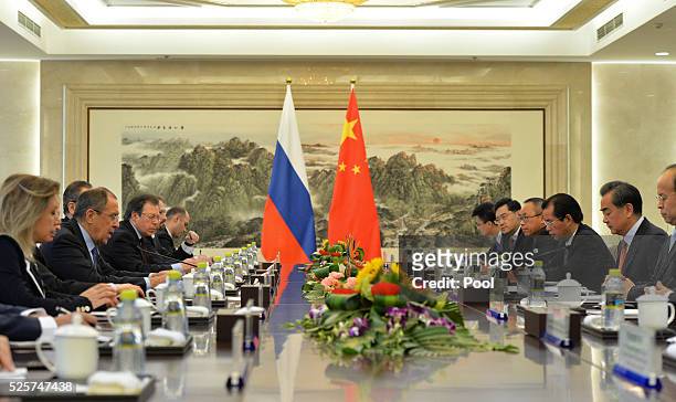 Russian Foreign Minister Sergey Lavrov speaks with Chinese Foreign Minister Wang Yi during a meeting at the Ministry of Foreign Affairs on April, 29...
