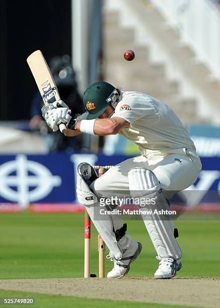 Shane Watson of Australia ducks away from a bouncer ball bowled by Andrew Flintoff of England