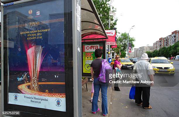 Bus stop in Bucharest, the captial of Romania with a posterr advertising the UEFA Europa League Final 2012 - Atletico Madrid v Athletic Bilbao