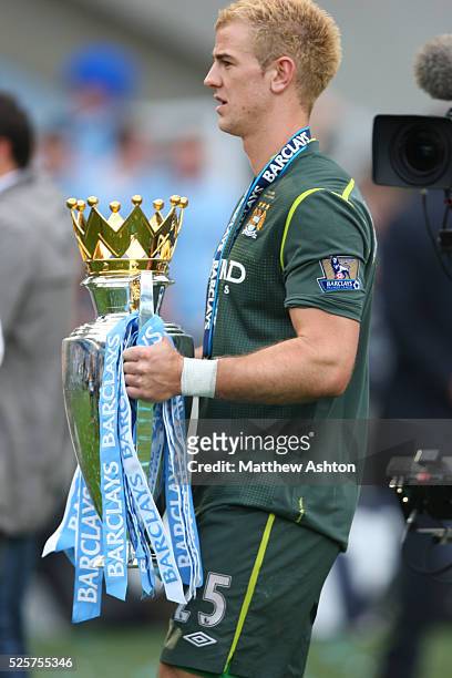 Joe Hart of Manchester City with the Barclays Premier League Trophy