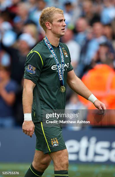 Joe Hart of Manchester City wearing his Barclays Premier League winners medal