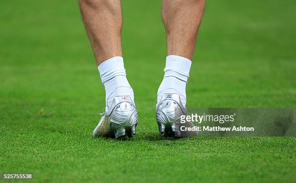 The football boots of David Beckham with the England and Croatia flags on along with the initials of himself, his wife Victoria and the names of his...
