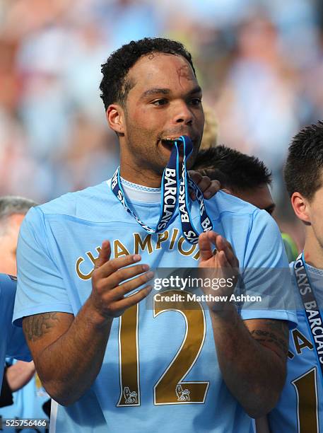 Joleon Lescott of Manchester City with this Barclays Premier League Winners medal