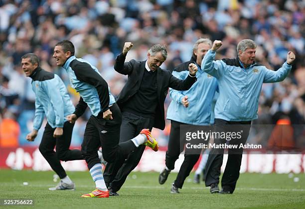 Roberto Mancini the head coach / manager of Manchester City celebrates after Sergio Aguero of Manchester City scores to make it 3-2 and Manchester...