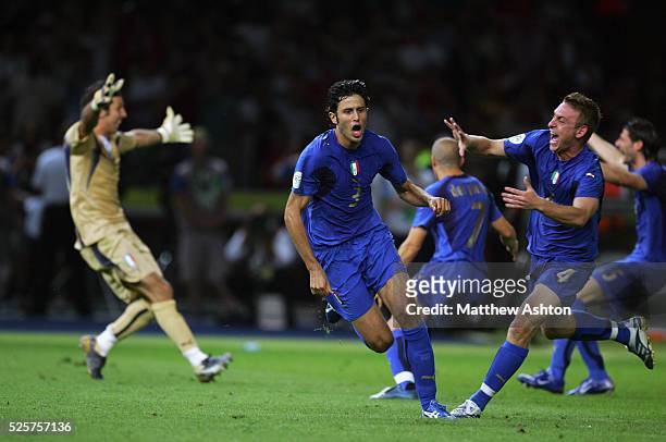 World Cup 2006 Final : Daniele De Rossi of Italy goes to congratulate Fabio Grosso after scoring the winning penalty kick in the shoot out