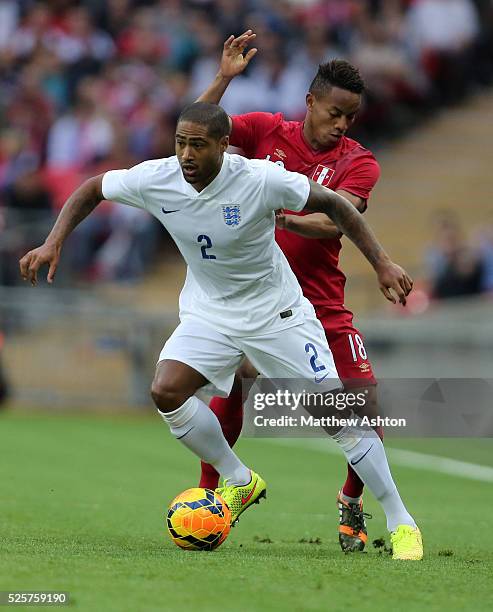 Andre Carillo of Peru and Glen Johnson of England