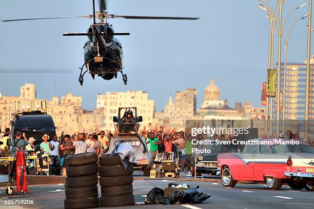 Helicopter equipped with a camera overflies the film set of the Fast & Furious 8 action movie at the Malecon seafront boulevard, on April 28 in...