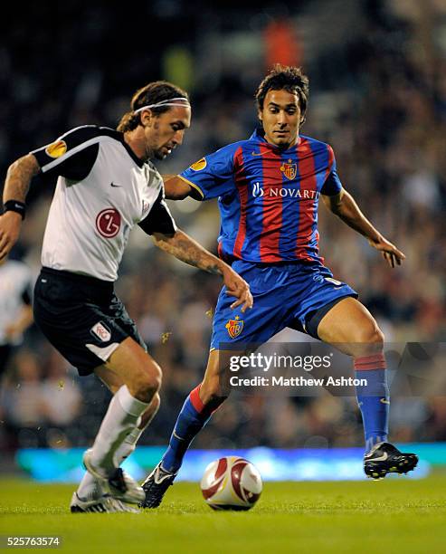 Jonathan Greening of Fulham and Marcos Gelabert of FC Basel