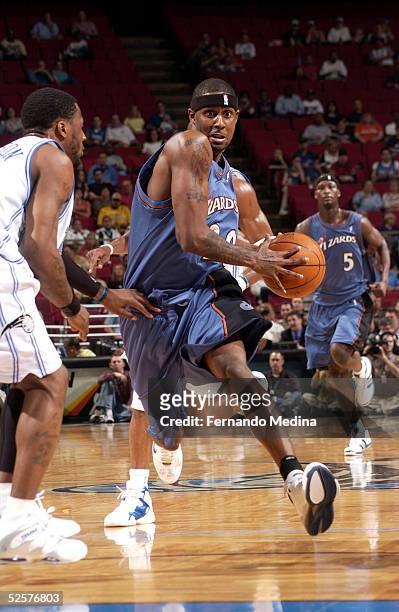 Larry Hughes of the Washington Wizards drives against DeShawn Stevenson of the Orlando Magic on April 1, 2005 at TD Waterhouse Centre in Orlando,...