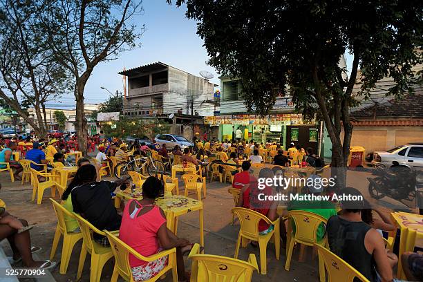 Fans gather around a television outside a bar in Gardenia Azul, Barra de Tijuca, Rio de Janeiro, Brazil for the FIFA World Cup 2014 to watch the...