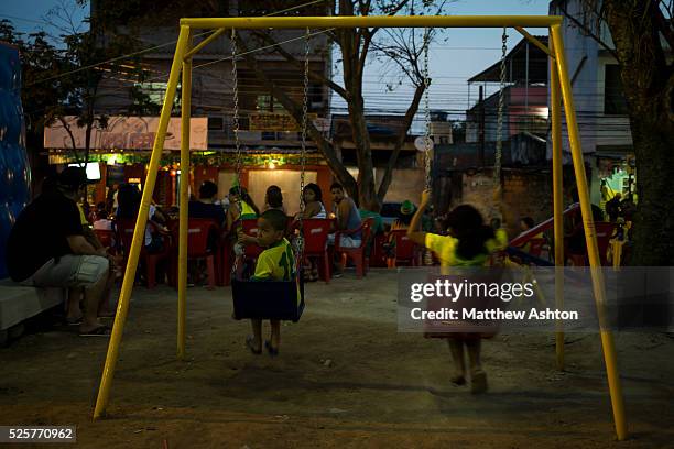 Fans gather around a television outside a bar in Gardenia Azul, Barra de Tijuca, Rio de Janeiro, Brazil for the FIFA World Cup 2014 to watch the...