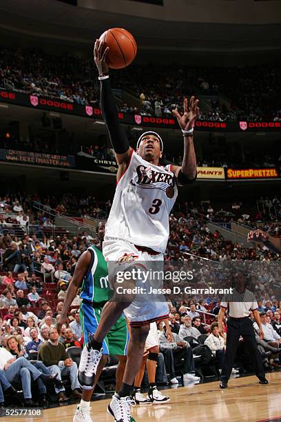 Allen Iverson of the Philadelphia 76ers drives against the Dallas Mavericks on April 1, 2005 at the Wachovia Center in Philadelphia, Pennsylvania....