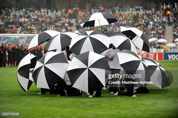 Dancers with black and white umbrellas during the opening ceremony of the Moses Mabhida Stadium in Durban, South Africa - one of the venues of the...