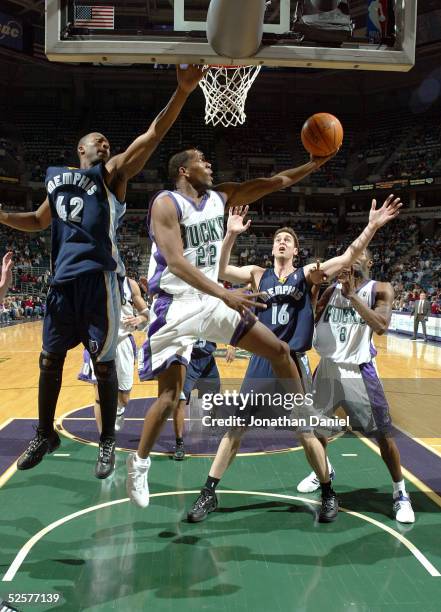 Michael Redd of the Milwaukee Bucks shoots a reverse layup against Lorenzen Wright and Pau Gasol of the Memphis Grizzlies on April 1, 2005 at Bradley...