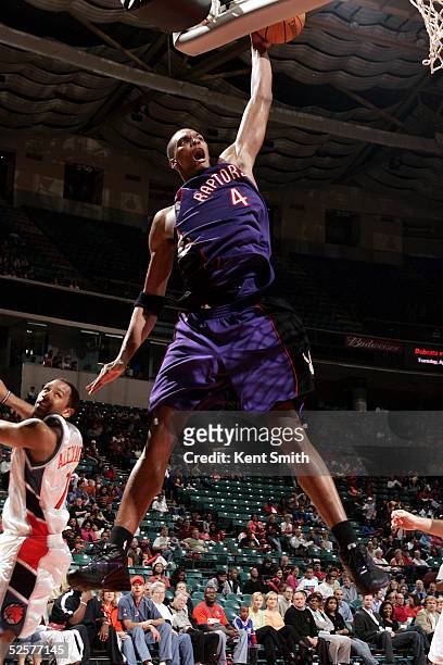 Chris Bosh of the Toronto Raptors attempts a dunk against the Charlotte Bobcats on April 1, 2005 at the Charlotte Coliseum in Charlotte, North...